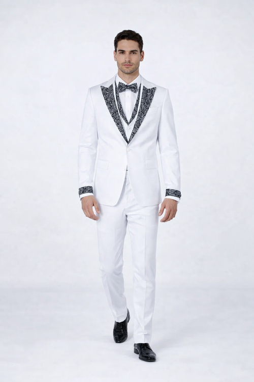 White men's tuxedo with black stone accents. Features a fitted white jacket with patterned black shawl lapel and cuffs, plus white trousers. Perfect for prom or weddings.
