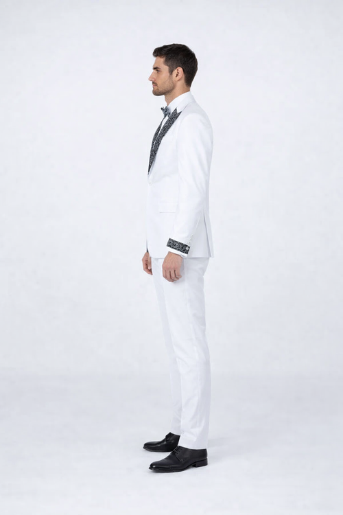 Men's white tuxedo with fitted silhouette, black stone lapel/cuffs. Single-button jacket, matching trousers. Perfect for prom or weddings.
