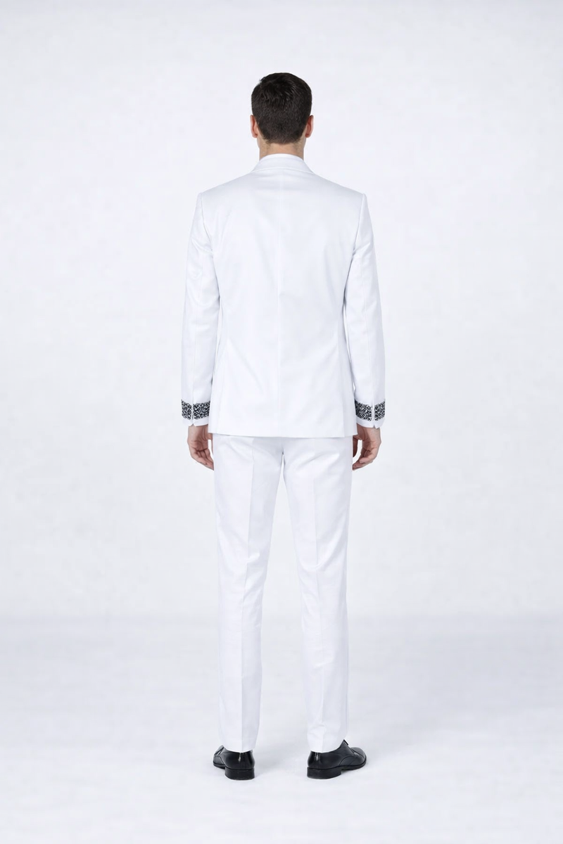 White tuxedo for men: structured silhouette, solid white fabric. Jacket with black decorative stones at cuff. Includes matching straight-leg trousers for prom or weddings.
