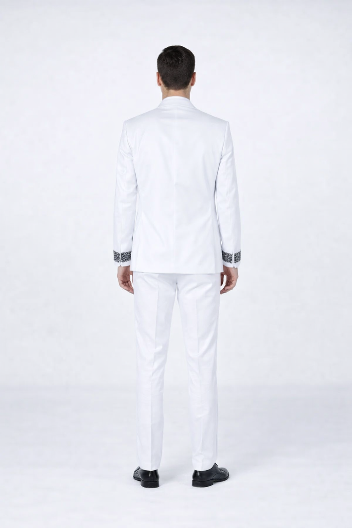 White tuxedo for men: structured silhouette, solid white fabric. Jacket with black decorative stones at cuff. Includes matching straight-leg trousers for prom or weddings.
