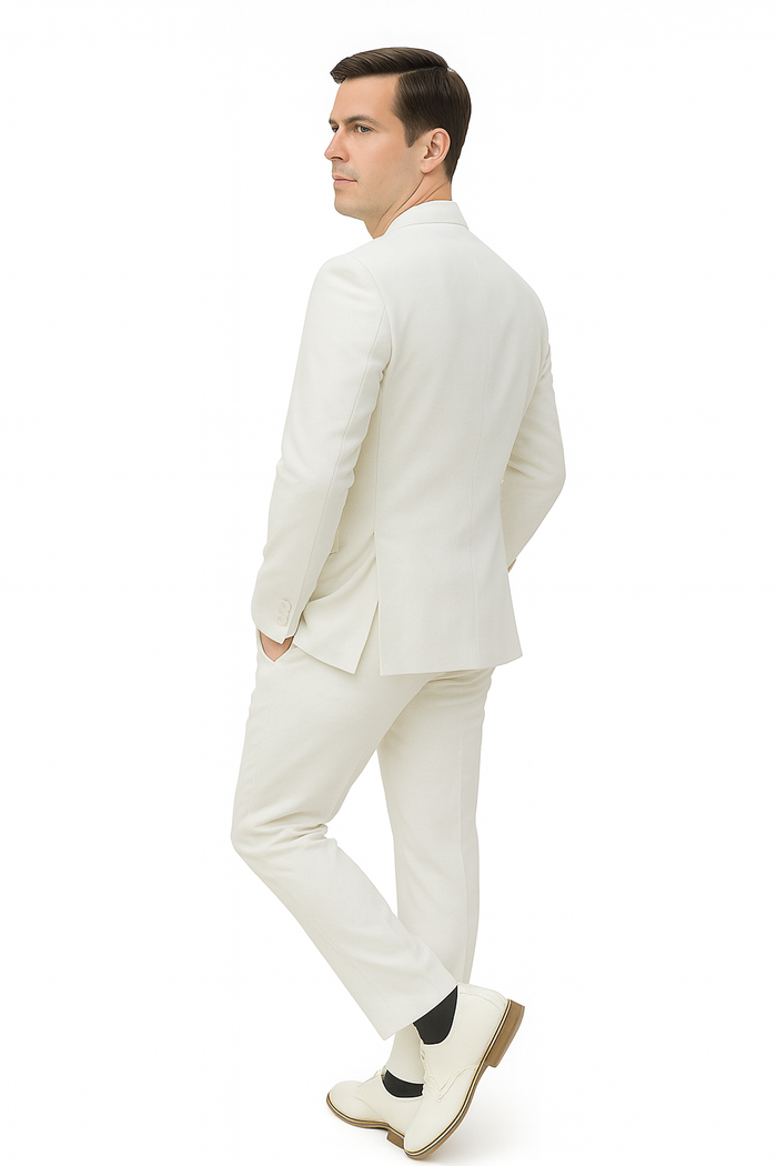 Men's white linen suit: relaxed fit, no collar jacket, single vent, straight-cut trousers. Lightweight, smooth material. Paired with light-colored shoes for a minimalist look.
