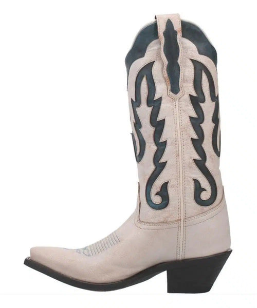 Laredo Keyla women's boot: tall, pointed-toe, slanted heel. Cream leather upper with dark blue accents and flame stitching. Pull tab for easy wear. Smooth shaft design.

