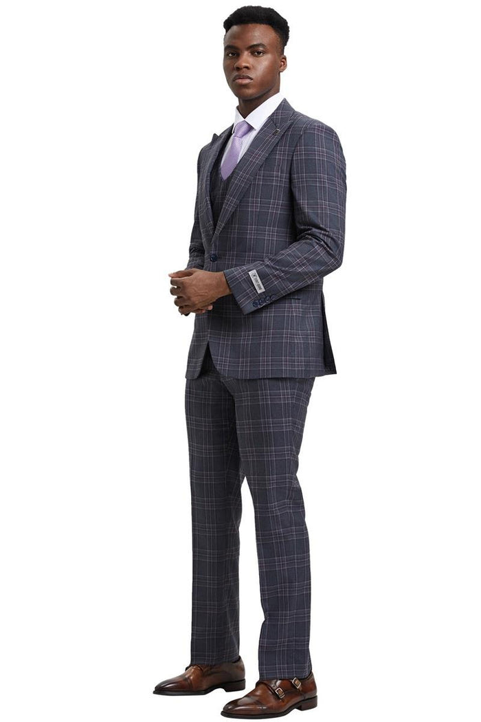 The men's Stacy Adams one button peak lapel double-breasted vest suit features a charcoal grey plaid pattern. The suit comprises a tailored jacket with a peak lapel and matching trouser.