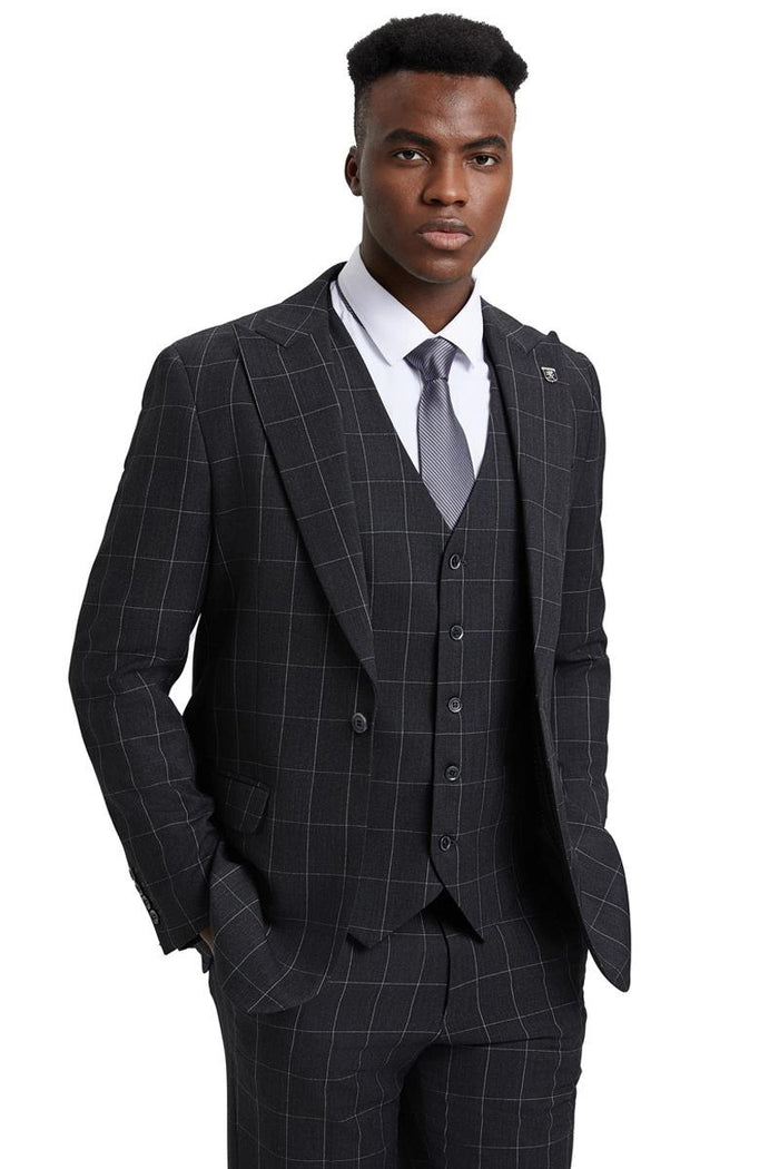 The men's Stacy Adams vest features a classic cut with a bold windowpane pattern in dark charcoal grey. The fabric appears to be a suit material, and the vest has a five-button closure and notch lapels. 