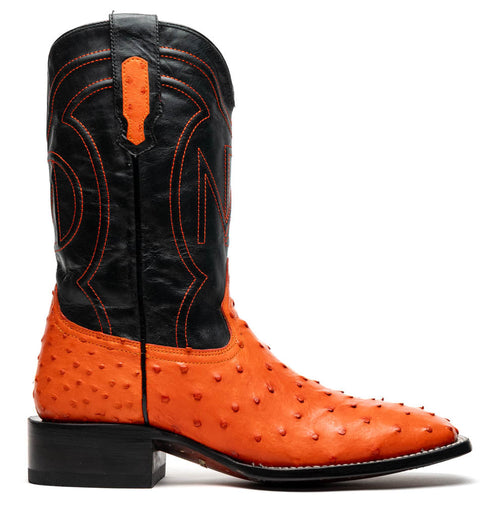 Vibrant orange ostrich quill Marco Di Milano cowboy boots. Square toe, black leather shaft, and black stitching. Slightly elevated heel for a defined silhouette.
