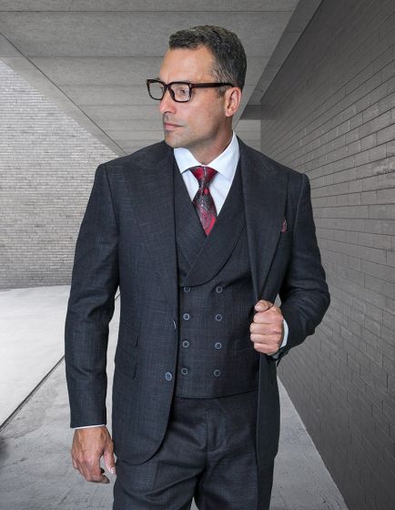 Statement mens 3 piece 100 wool modern fit suit features a peak lapel design, tailored jacket, and matching trousers. The suit is primarily dark gray with a subtle check pattern and includes a waistcoat that has a double-breasted front with button closures.
