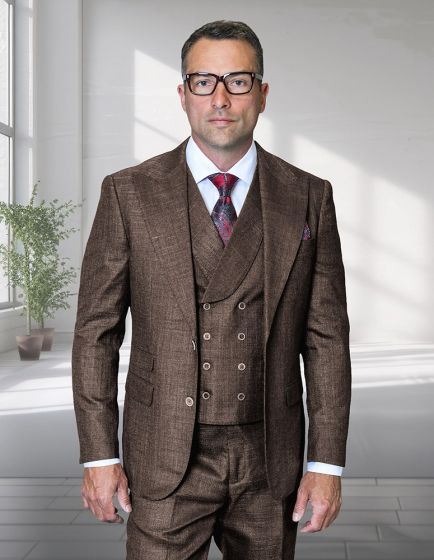 The Statement men's 3-piece suit features a modern fit with a peak lapel design. It is constructed from 100% wool in a brown color with a subtle textured pattern. The suit includes a fitted vest with buttons and a matching trouser design.