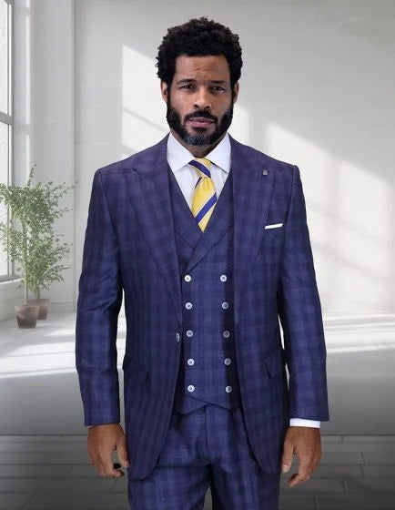 Statement men's 3-piece wide-leg suit features a windowpane plaid pattern primarily in dark blue with lighter blue and white lines. The suit comprises a jacket, vest, and trousers, all designed with a tailored fit. The jacket has a notched lapel and a single-breasted front with visible buttons. The vest is buttoned and layered beneath the jacket, while the trousers have a wide-leg silhouette.
