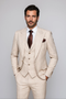 Beige wool suit with plaid pattern. Includes fitted jacket (peaked lapels, pockets) and a three-piece vest (V-neck, buttons). Tailored pants.
