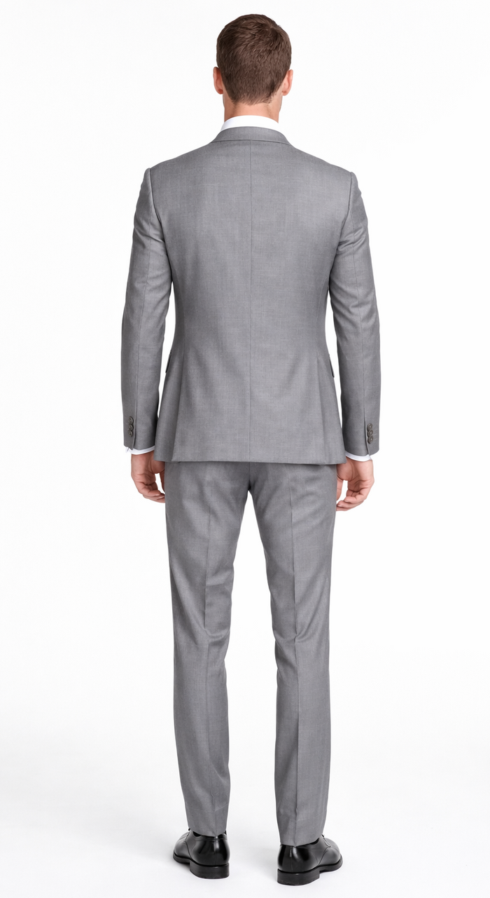 Bertolini light gray wool-silk suit. Tailored fit, two-button closure, notch lapels. Straight-leg trousers. Fine texture and structured shape. Complete ensemble.
