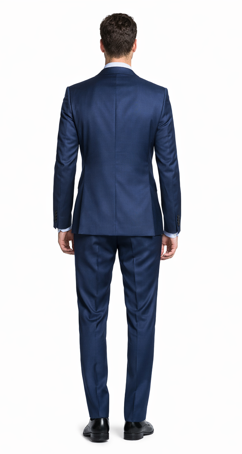 Bertolini French blue wool-silk suit: Tailored blazer with structured shoulders & streamlined trousers. Smooth, deep blue fabric with a subtle sheen. Fitted silhouette.
