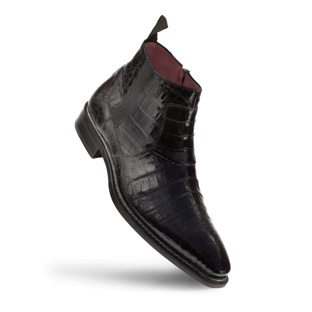 Mezlan Blackmore crocodile dress boots: Ankle-height, pointed toe, sleek silhouette. Black crocodile leather exterior with glossy finish. Elastic panels for fit. Burgundy interior. Smooth sole.
