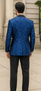 Blue double-breasted jacket with rough streak pattern and satin finish. Peak lapel, tailored fit, structured shoulders, and long sleeves.
