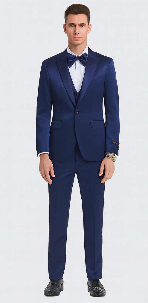 Blue satin Tazzio three-piece suit. Slim fit, double-breasted with peak lapel. Structured shoulders, straight-leg trousers. Smooth, glossy fabric.
