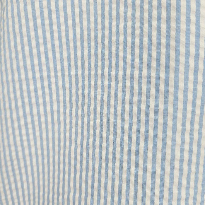 Blue seersucker 2pc set by Alberto Nardoni. Light blue and white striped, textured fabric. Lightweight with a crinkled seersucker surface.