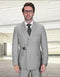 The Statement mens 2-piece suit features a modern fit, double-breasted design in a light gray color. It is made from 100% wool, with visible metal buckle detailing on the front. The jacket has a single chest pocket and a structured silhouette, with tailored sleeves and a matching pair of trousers.