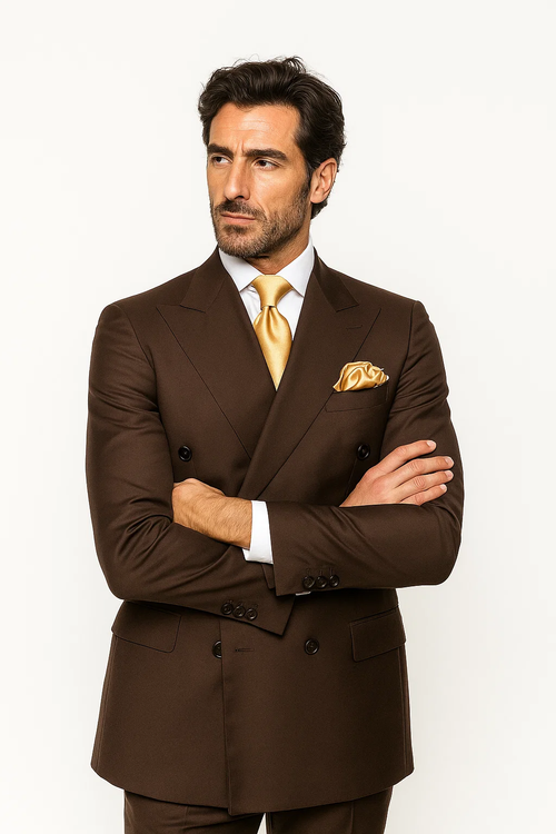 Classic fit brown suit (100% wool). Double-breasted jacket with wide lapels. Baggy, pleated wide-leg pants in matching brown, creating a cohesive, stylish ensemble.