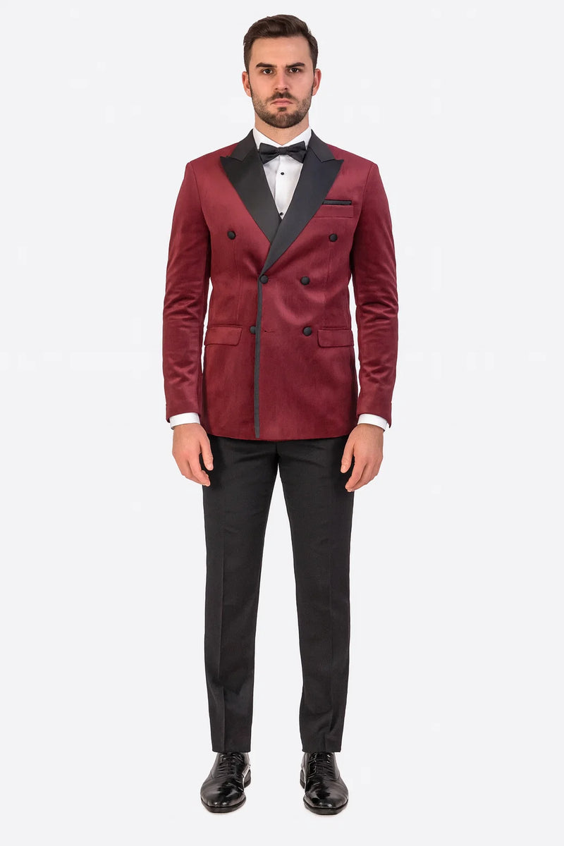 Burgundy velvet double-breasted tuxedo jacket. Black peaked lapels, six front buttons, and dual side pockets. Rich, textured fabric.
