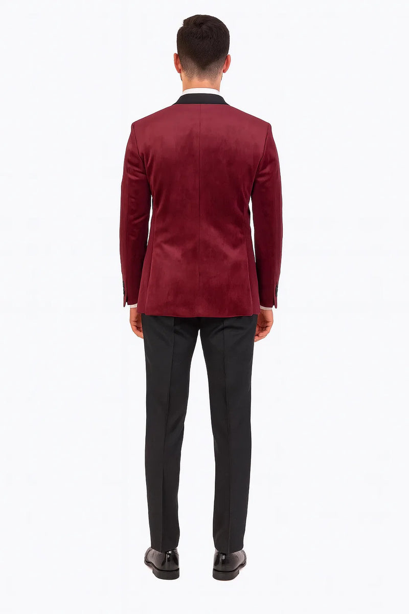 Alberto Nardoni's burgundy velvet double-breasted tuxedo jacket. Tailored fit, structured shoulders, and black satin lapel. Luxurious velvet, smooth finish, and double-breasted closure. Clean back silhouette.
