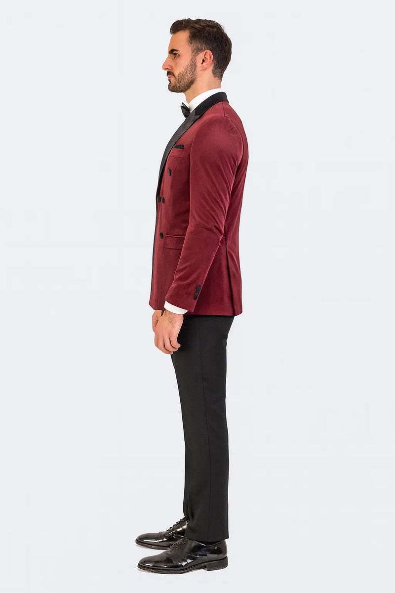 Burgundy velvet double-breasted tuxedo jacket. Fitted silhouette, rich burgundy color, black accents. Notched lapel, two rows of buttons, side pockets, fitted sleeves. Plush velvet material, formal style.
