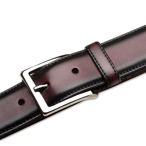 Burgundy Mezlan calfskin belt with shiny patina. Features a silver rectangular buckle and adjustable sizing. Structured, flat design with visible edge stitching. Classic and refined.
