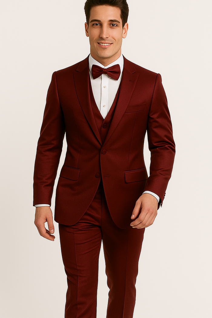 Alberto Nardoni's Burgundy Majesty tuxedo: fitted jacket, trousers, vest, and bow tie. Deep burgundy, smooth fabric, classic lapels, and three-button jacket closure. Completes a formal ensemble.
