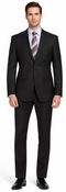 Carlo Lusso black suit: tailored fit, poly blend. Two-button jacket, notch lapels. Straight leg trousers. Solid black, smooth finish with subtle sheen. Flexible, structured silhouette.
