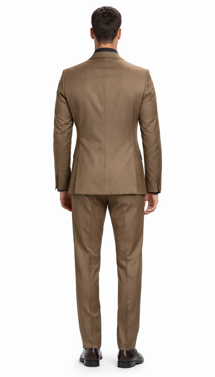 Carlo Lusso brown two-button suit: tailored fit, poly blend with sheen. Brown blazer, matching trousers. Structured silhouette, no back vents. Darker dress shoes complete the look.
