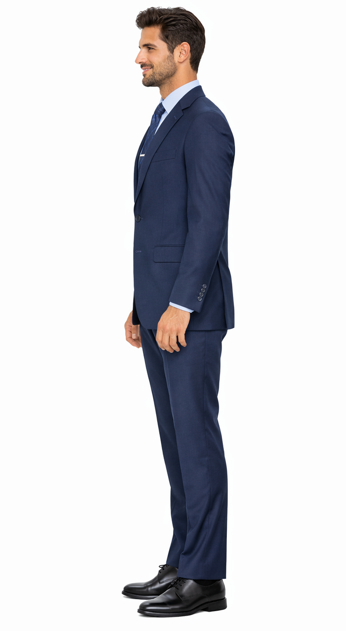 Carlo Lusso French blue suit: tailored fit, structured jacket with notch lapel, slim pants. Solid, mid-weight fabric. Paired with black dress shoes.
