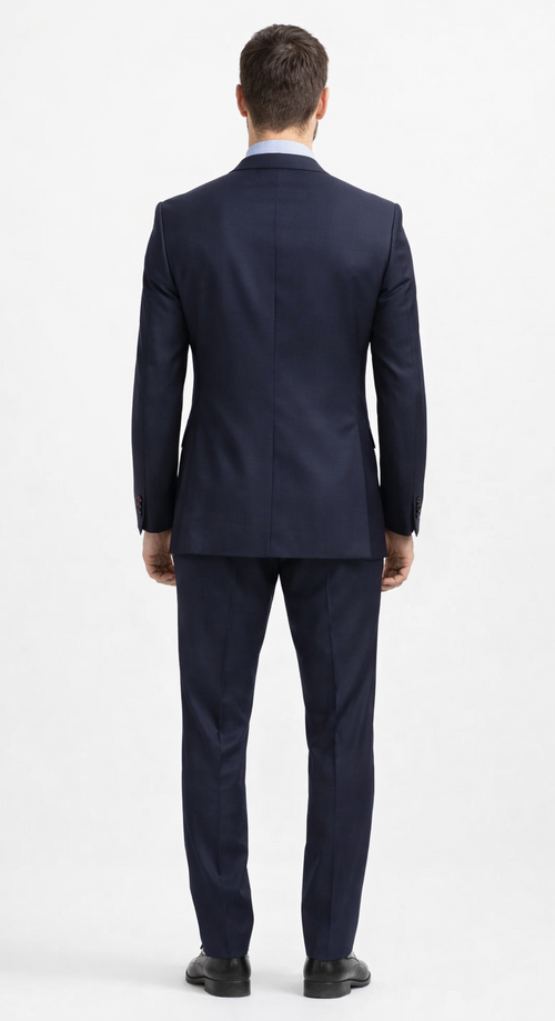 Carlo Lusso navy two-button suit: Tailored fit, single vent. Durable poly blend with subtle texture. Solid navy color, includes matching trousers.
