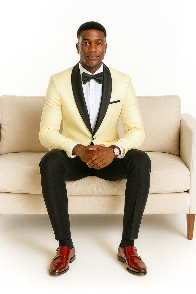 Ivory jacket with black lapel, paired with black trousers. Includes a matching bowtie and brown dress shoes. A classic, elegant ensemble.

