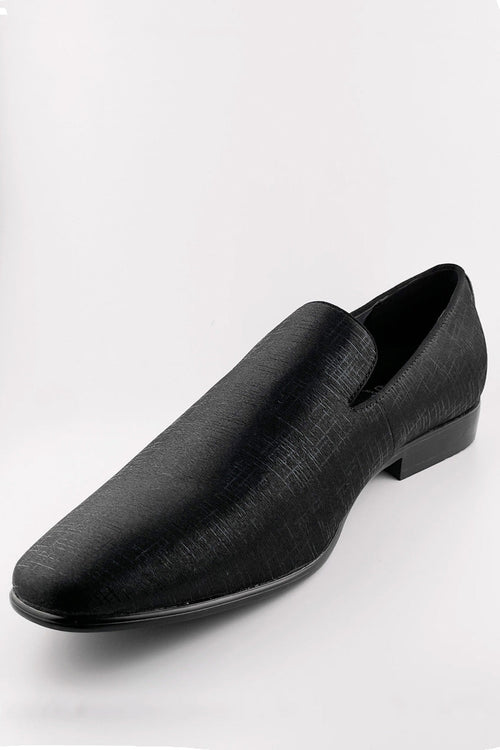 1910s Sharkskin tuxedo shoes: Black, textured, pointed slip-ons with a subtle sheen and low heel. Classic couture style.
