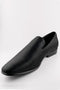 1910s Sharkskin tuxedo shoes: Black, textured, pointed slip-ons with a subtle sheen and low heel. Classic couture style.