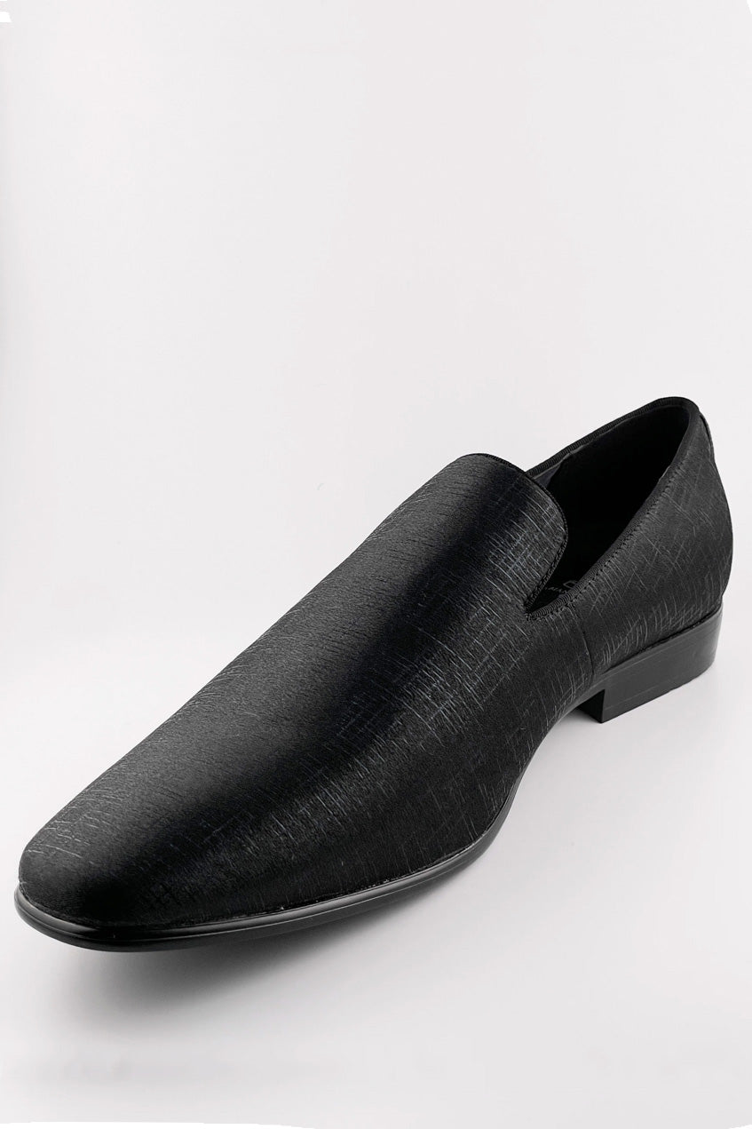 1910s Sharkskin tuxedo shoes: Black, textured, pointed slip-ons with a subtle sheen and low heel. Classic couture style.
