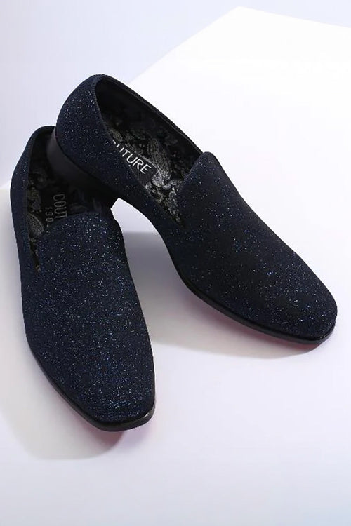 Alberto Nardoni's 1910 couture tuxedo shoes. Royal blue, shimmery upper with pointed design and low vamp. Flat sole, smooth black interior. Sparkling texture.