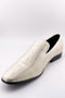 Alberto Nardoni's 1910 couture tuxedo shoes: sharkskin gold, slip-on, pointed toe. Light beige textured exterior. Black leather heel, contrasting black interior lining.