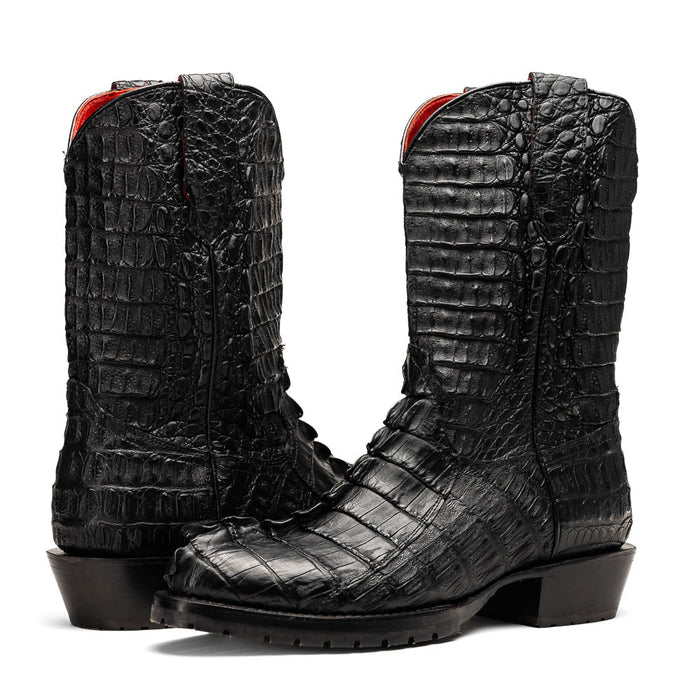 Marco Di Milano Marlboro Black cowboy boots: tall, black hornback crocodile tail. Pointed toe, tractor sole, slight heel. Red lining. Vertical stitching, shiny finish, distinct scales.
