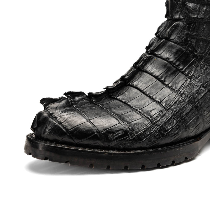 Marco Di Milano Marlboro cowboy boots in black with hornback crocodile tail leather and a tractor sole. Pointed toe, textured design for rugged wear.
