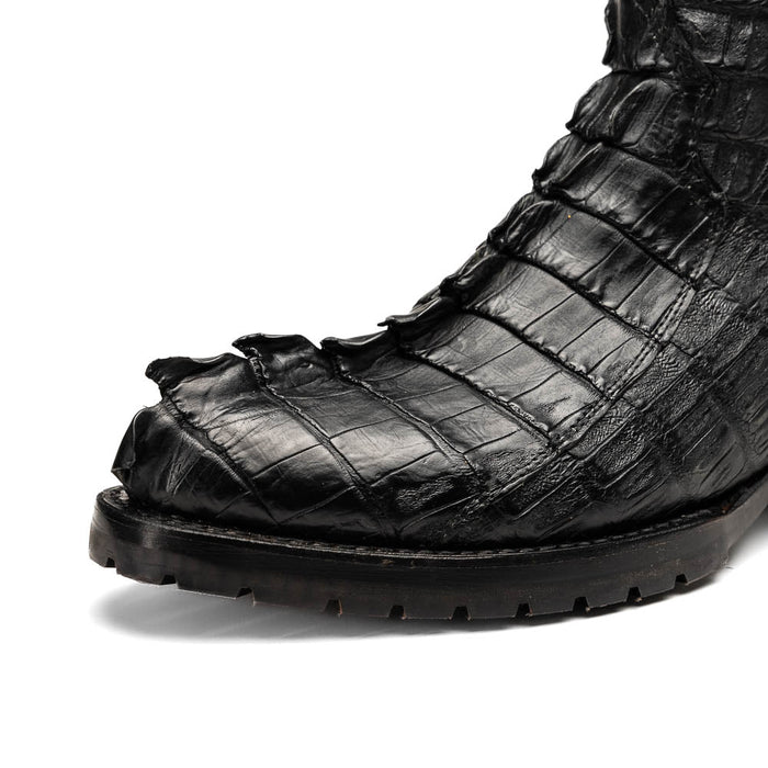 Marco Di Milano Marlboro cowboy boots in black with hornback crocodile tail leather and a tractor sole. Pointed toe, textured design for rugged wear.
