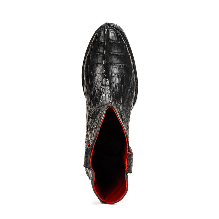 Black hornback crocodile cowboy boots by Marco Di Milano. Pointed toe, sleek silhouette, and a textured pattern. Red interior lining. Tractor sole for sturdy design.
