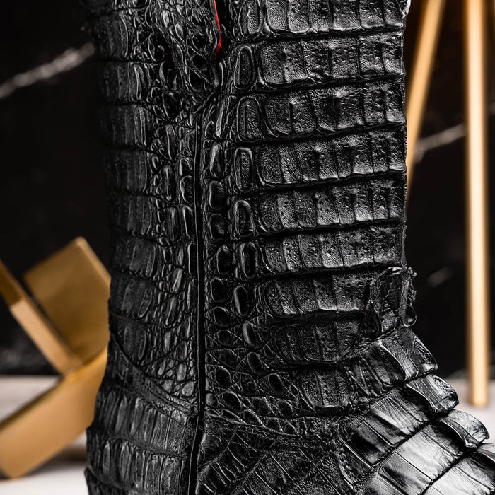 Marco Di Milano Marlboro Black cowboy boots. Black hornback crocodile tail leather. Tractor sole. Pointed toe, structured shaft, and side zipper. Rugged construction with distinctive raised scales.
