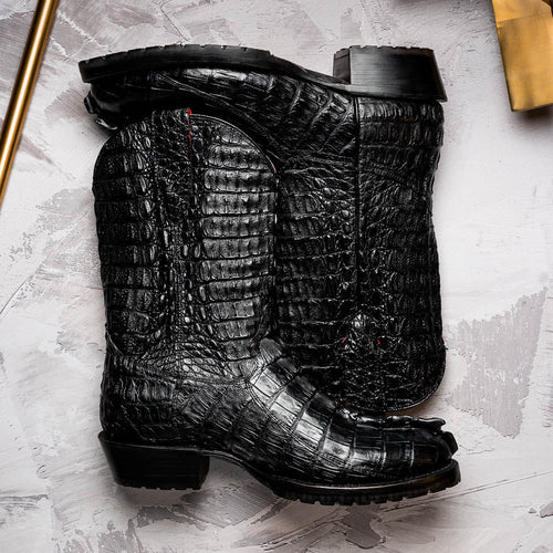 Marco Di Milano Marlboro Black cowboy boots. Tall shaft, hornback crocodile tail texture, pointed toe. Tractor sole for rugged look, block heel. Structured design with detailed stitching.
