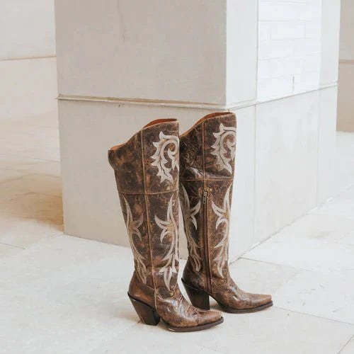 Dan Post Jilted women's snip toe boots. Brown leather with textured finish and white floral embroidery. Stacked heel. Symmetrical upper.
