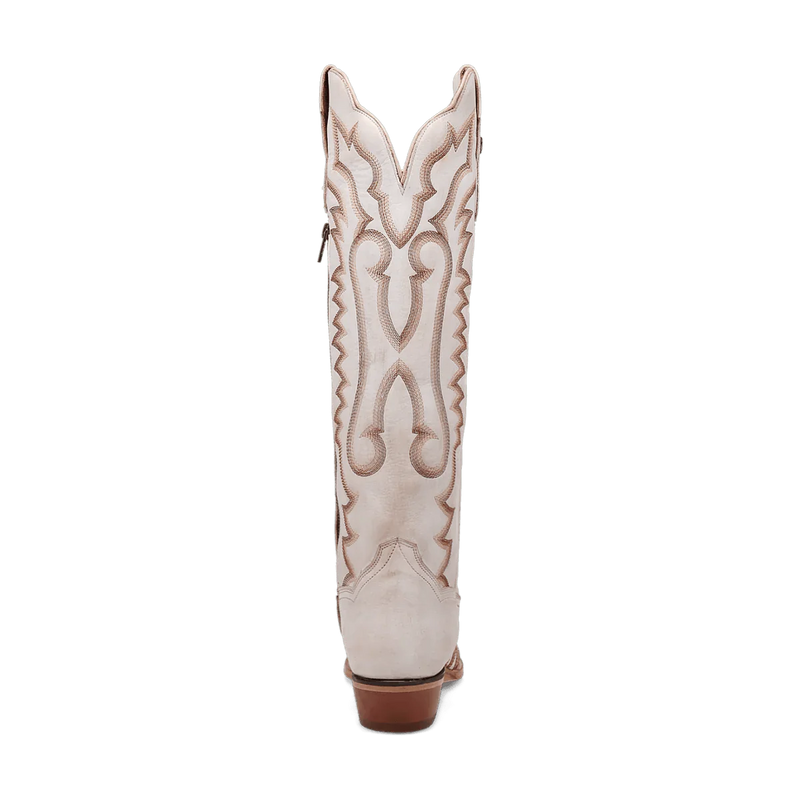 White Dan Post Josie boots. Tall shaft, snip toe, and small heel. Decorative tan stitching in swirling side pattern. Crafted from smooth leather.
