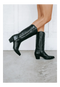Dan Post Maria boots: black leather, snip toe, tall shaft with stitching, stacked heel. Sleek design with a slight top curvature.
