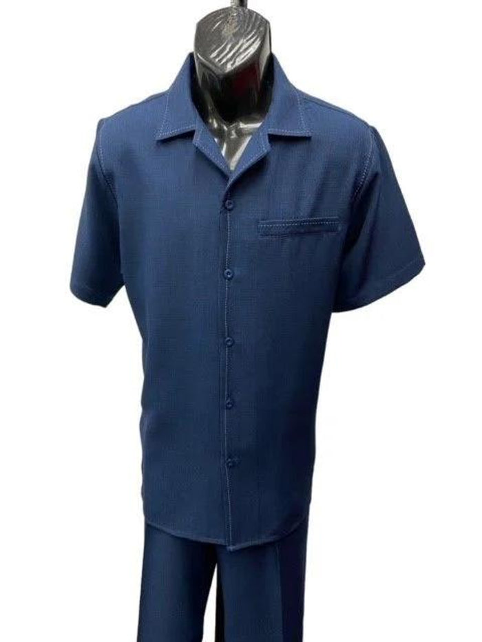 Men's navy patterned walking suit. Short sleeve, collared top with button front, chest pocket. Textured fabric with subtle pattern.
