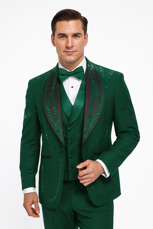Hunter green Italian wool tuxedo. Modern fit, 3-piece with black satin detailing. Includes jacket, vest, trousers, and bow tie. Subtle sparkles accent the ensemble.