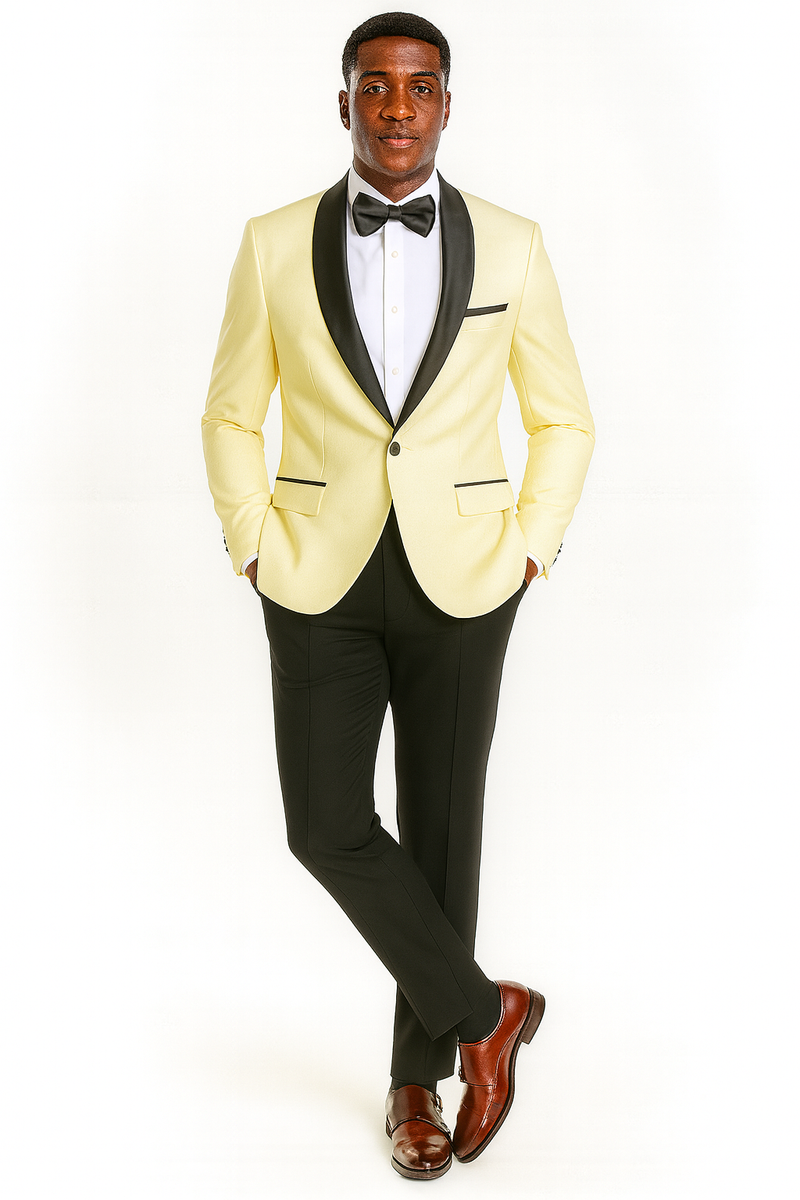 Ivory suit: fitted jacket w/ black shawl collar, single button, front pockets. Tailored black pants. Black bowtie and white shirt. Formal attire, ideal for special occasions.
