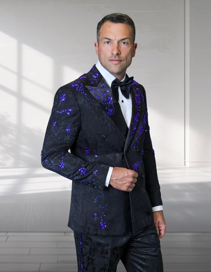 Statement men's 2 piece modern fit double breasted tuxedo features a black fabric with a reflective finish. The jacket displays a double-breasted design with notched lapels and is adorned with purple embellishments. The accompanying trousers are similarly styled.