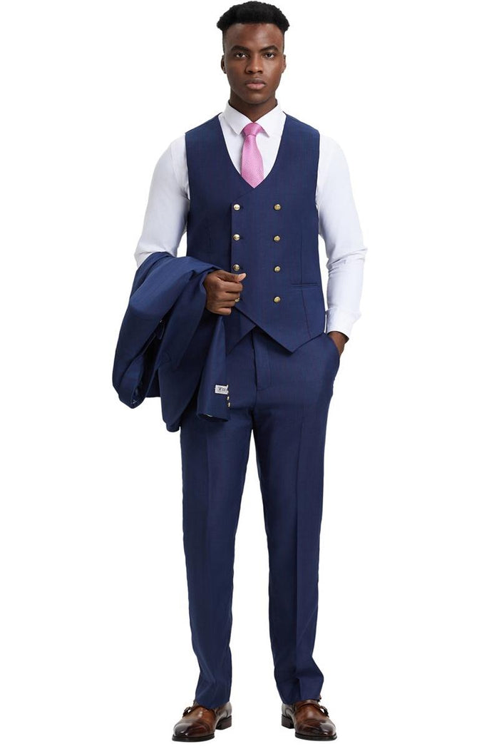 Navy pinstripe Stacy Adams one-button suit. Double-breasted vest with gold buttons, side peak lapel. Matching trousers. Jacket held in model's left arm.
